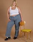 Juliet is wearing Railroad Denim Work Pants in Natural and Cropped Tank in Vintage Tee White