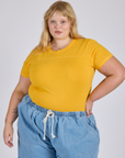 Juliet is wearing Jr. Varsity Tee in Sunshine Yellow