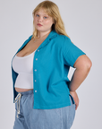 Angled front view of Pantry Button-Up in Hawaiian Blue on Juliet