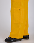 Drop Pocket Cargo Pants in Sunshine Yellow pant leg side view close up on Isaac
