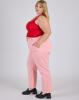 Side view of Work Pants in Baby Pink and mustang red Cropped Tank on Juliet