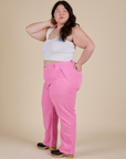 Side view of Work Pants in Bubblegum Pink and Cropped Tank in Vintage Tee White on Ashley