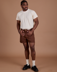 Isaac is wearing Classic Work Shorts in Fudgesicle Brown and Organic Vintage Tee in Vintage Off-White