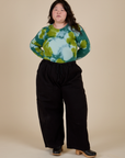 Long Sleeve Baby Tee in Green Magic Waters tucked into black Drop Pocket Cargo Pants