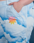 Close up of Ashley's hand in the front pocket of Work Pants in Sunny Cloud Airbrush