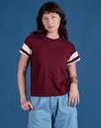 Alex is wearing Painted Vintage Tee in Red Wine