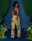 Angled back view of Paintstamped Work Pants in Froggy and espresso brown Cropped Tank on Kandia