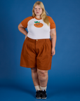 Juliet is wearing Produce Raglan Tee in Orange