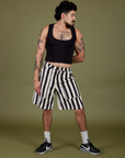 Jesse is 5’8” and wearing S Longline Work Shorts in Natural paired with black Cropped Tank