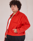 Mechanic Jacket in Mustang Red side view on Miguel