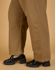 Pant leg side view close up of Baggy Mid-Rise Trousers in Desert Brown on Juliet