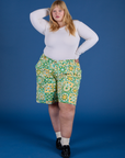 Juliet is 5’7” and wearing 2XL Longline Work Shorts in Spring Quilt Print paired with vintage tee white Long Sleeve Baby Tee