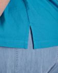 Close up of Pantry Button-Up in Hawaiian Blue side vent on Juliet