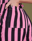 Close up of Alex's hand in the back pocket of Longline Work Shorts in Bubblegum Pink