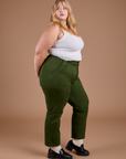 Side view of Organic Work Pants in Evergreen and vintage tee white Cropped Tank on Juliet