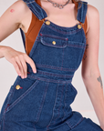 Carpenter Overalls in Dark Wash front close up on Alex
