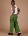 Denim Drop Pocket Pants in Green Overdye angled back view on Isaac