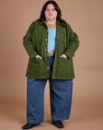 Sam is wearing Ripstop Field Coat in Evergreen and french blue Drop Pocket Cargo Pants
