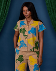 Kandia is wearing a buttoned up Paintstamped Pantry Button-Up in Froggy