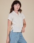Angled front view of Pantry Button-Up in Vintage Tee White on Alex