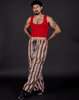 Striped Drop Pocket Pants in Retro Rainbow and mustang red Cropped Tank angled view on Jesse
