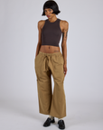 Kira is 5’10” and wearing XS Drop Pocket Cargo Pants in Desert Brown paired with espresso brown Racerback Tank
