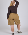 Back view of Longline Work Shorts in Desert Brown and espresso brown Long Sleeve Baby Tee on Juliet