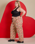 Side view of Hot Stuff Drop Pocket Cargo Pants and black Cropped Tank on Juliet