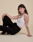 Work Pants in Basic Black and Cropped tank in Vintage Tee White on Alex