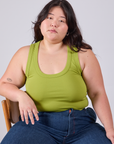 Ashley is wearing Cropped Tank Top in Gross Green