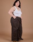 Side view of Drop Pocket Cargo Pants in Espresso Brown and Cropped Tank in Vintage Tee White on Ashley