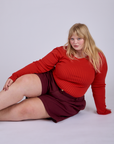 Juliet is wearing Pleated Trouser Shorts in Red Wine and Long Sleeve Gingham Baby Tee in Mustang Red