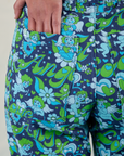 Close up of Shahana's hand in the back pocket of Work Pants in Angel Print