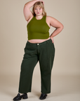 Juliet is wearing Racerback Tank in Summer Olive and swamp green Work Pants