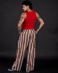 Angled back view of Striped Drop Pocket Pants in Retro Rainbow and mustang red Cropped Tank