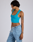 Angled front view of Cropped Tank Top in Hawaiian Blue on Kira