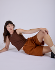 Pleated Trouser Shorts in Burnt Terracotta and fudgesicle brown Muscle Tee on Alex