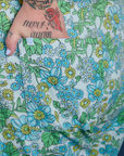 Close up of Sam's hand in the back pocket of Winter Floral Print Work Pants