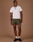 Jerrod is 6'3" and wearing M Classic Work Shorts in Surplus Green paired with a vintage off white Organic Vintage Tee