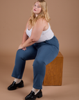 Juliet is wearing Organic Work Pants in French Blue and a vintage tee white Cropped Tank