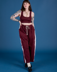 Sydney is 5’9” and wearing L Painted Drop Pocket Cargo Pants in Red Wine