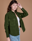 Angled front view of Cropped Corduroy Overshirt in Evergreen on Alex