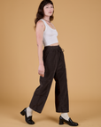 Corduroy Drop Pocket Cargo Pants in Espresso Brown and Cropped Tank in Vintage Tee White side view on Alex