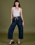 Alex is 5’8” and wearing XXS Denim Drop Pocket Pants in Dark Wash paired with a Cropped Tank in Vintage Tee White