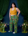 Side view of Work Pants in Pond Party and mustard yellow Cropped Tank on Ashley