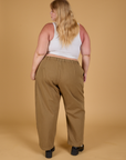 Baggy Mid-Rise Trousers in Desert Brown back view on Juliet