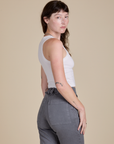 Racerback Tank in Vintage Tee White angled back view on Alex