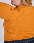 Jr. Varsity Tee in Creamsicle Orange back view close up on Juliet