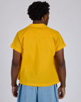 Pantry Button-Up in Sunshine Yellow back view on Isaac