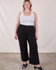 Lish is 5'8" and wearing XL Western Pants in Basic Black paired with a Cropped Tank in Vintage Tee Off-White